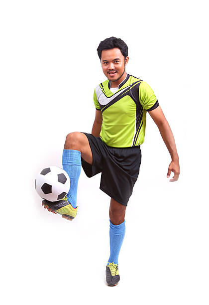 istock Young soccer football player on white 482082115
