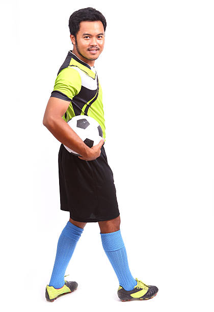 istock Young soccer football player on white 482082845