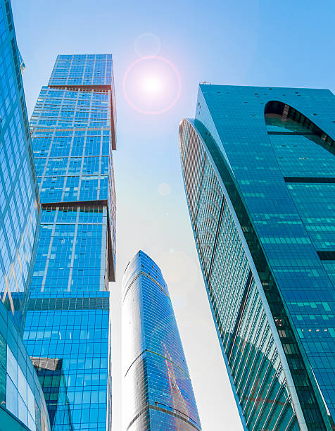 istock Perspective wide angle view to blue glass building skyscrapers 482084250