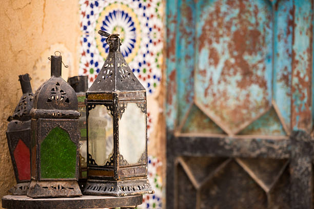 Moroccan lantern lamp shade hanging in golden evening sunlight at souk