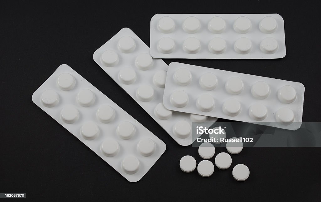 Tablet blister packs and open tablets 2015 Stock Photo