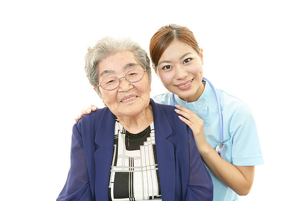istock Smiling nurse with old woman 482089695