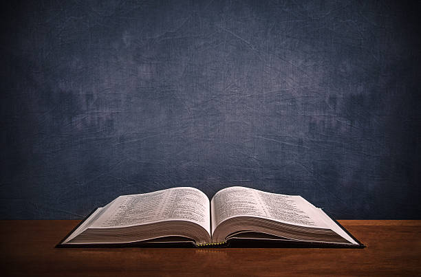 istock Open Bible on a wood desk 482091838
