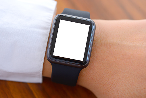 Woman wearing a blank white screen smart watch. 