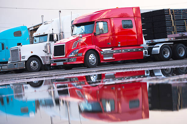 istock Big rig semi truck flat bed trailer cargo parking lot 482092130
