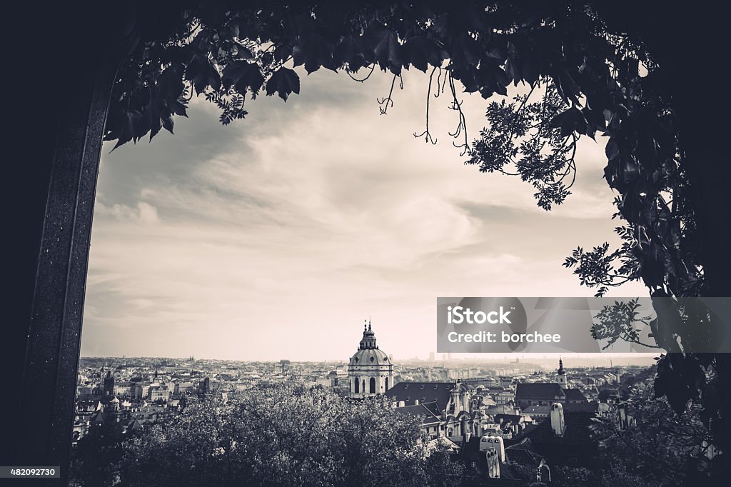 Prague In Black And White View on Saint Nicholas's Cathedral (Prague, Czech Republic) from garden pavilion. Black and white photo. Arch - Architectural Feature Stock Photo