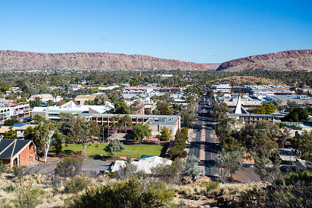 View over Alice Springs View from Anzac Hill down Hartley St on a fine winter's day in Alice Springs, Northern Territory, Australia alice springs photos stock pictures, royalty-free photos & images