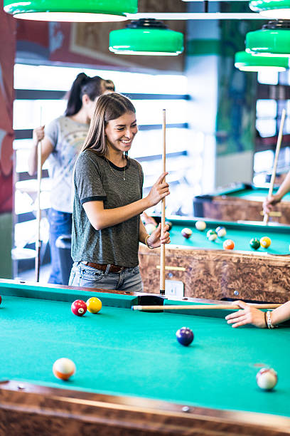 istock Group of friends playing pool 482095858