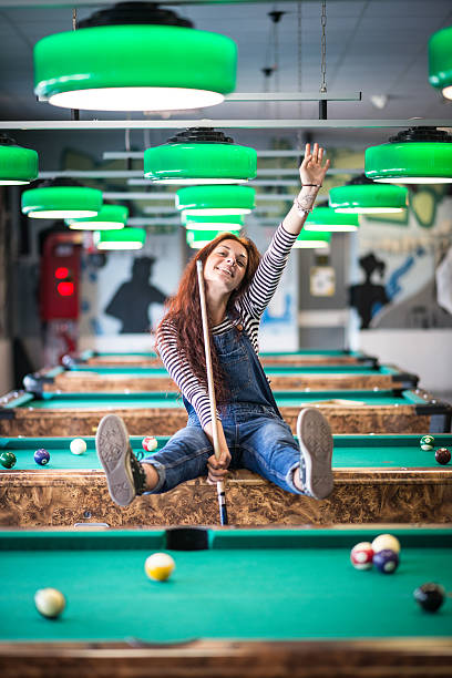 istock Young woman in the pool hall 482095876