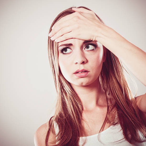 istock woman suffering from head pain 482096000