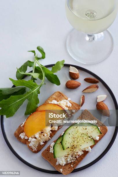 Fresh Cheese Canape With Sliced Nectarine And Cucumber Stock Photo - Download Image Now