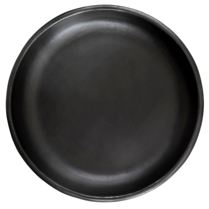 Empty black stoneware plate, isolated on white backgrround.