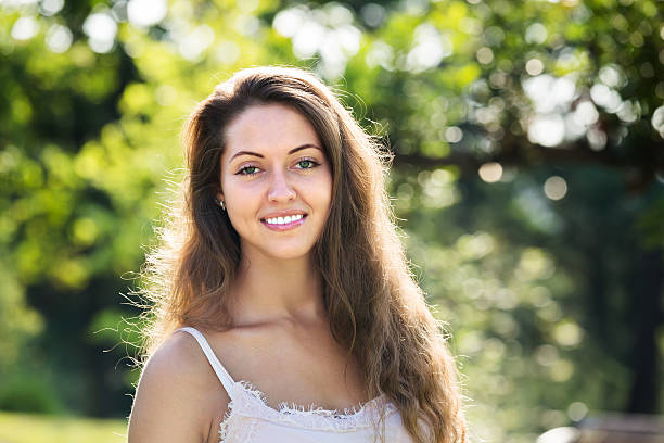 istock Smiling girl in summer park 482097024