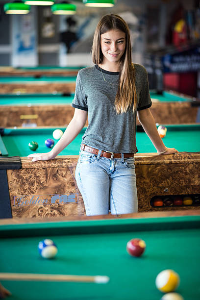 istock Young woman in the pool hall 482097278