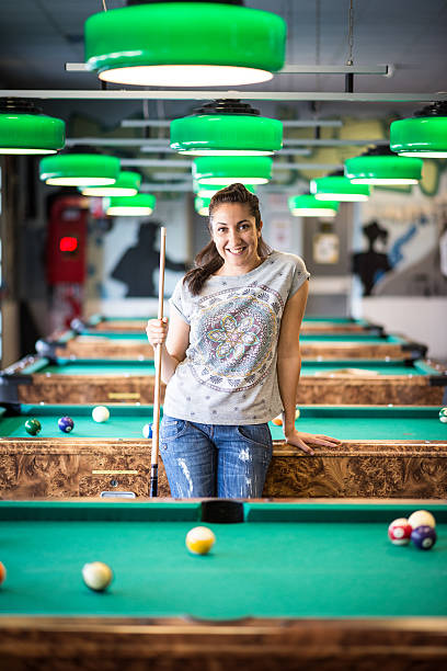 istock Young woman in the pool hall 482097284