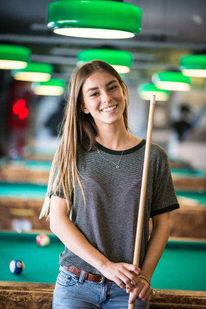 istock Young woman in the pool hall 482097288