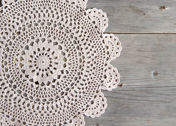 istock Crochet doily over old grey wood 482097425