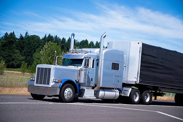 istock Big classic semi truck rig tall pipes custom trailer black 482102032