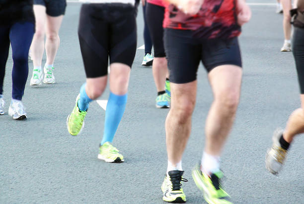 istock Group Of People Running To Become Physically Fit 482104334