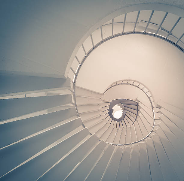 istock Low angle view of a spiral staircase 482105186