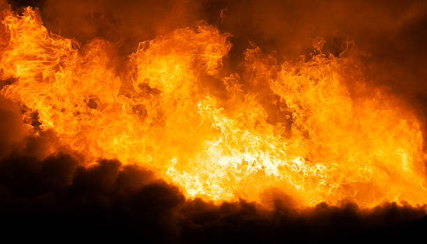 istock Burning fire flame on wooden house roof 482105494