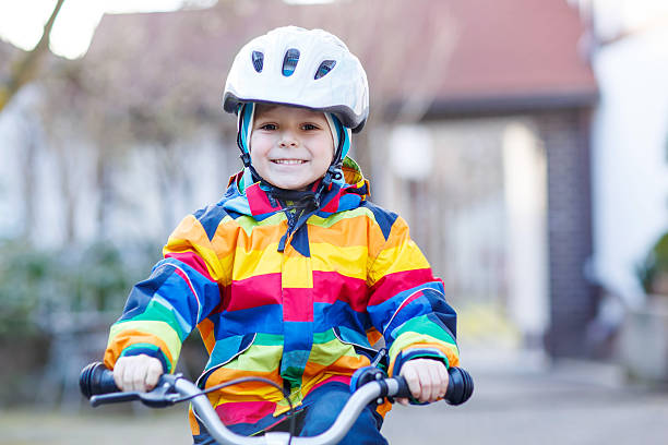 istock Little blond kid boy with bicycle, outdoors. 482110906
