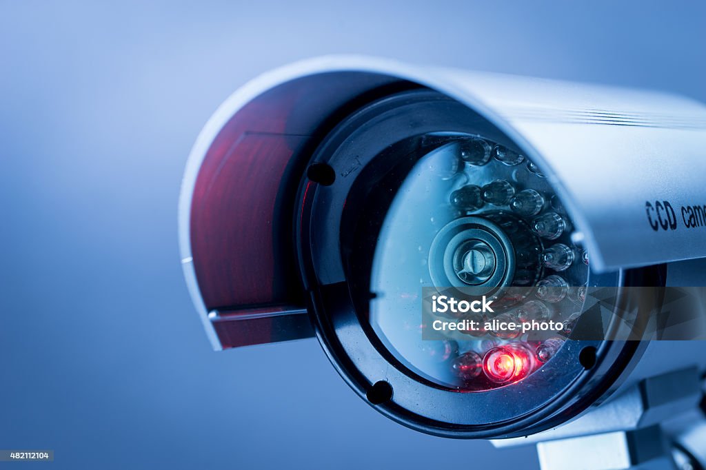Security CCTV camera in office building Security, CCTV camera for office building at night in London. Security Camera Stock Photo