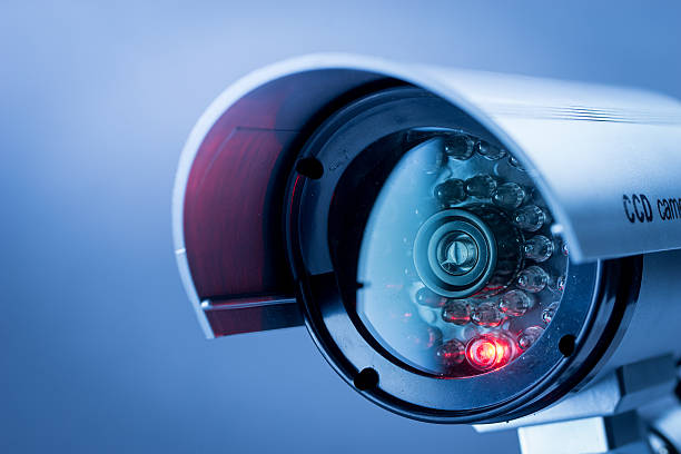 Security CCTV camera in office building Security, CCTV camera for office building at night in London. safe security equipment stock pictures, royalty-free photos & images