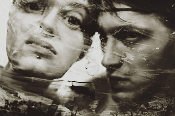istock man's and woman's faces at a dirty muddy glass 482112678