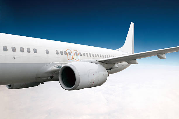 istock Wing of an airplane cruising above the clouds 482113524
