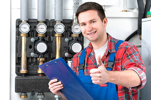 Technician servicing heating boiler Technician servicing the gas boiler for hot water and heating Plumbing Inspections Are Important When Buying a Home stock pictures, royalty-free photos & images