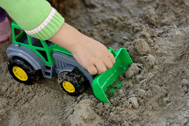 istock Child with green excavator 482116752