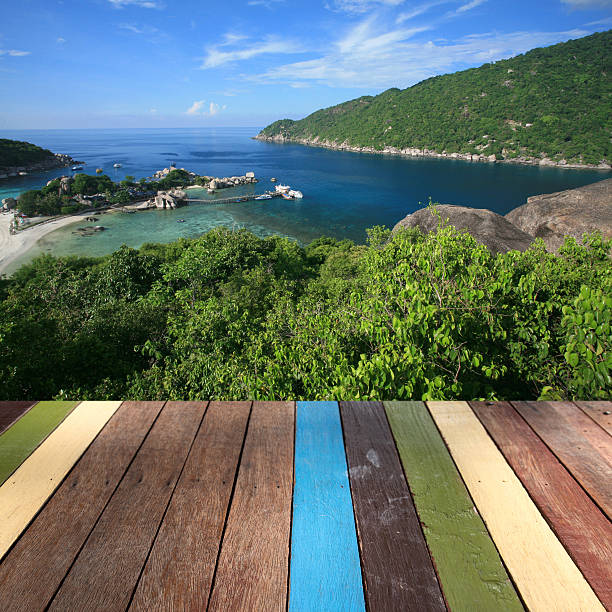istock Wood table top on seascape background montage concept 482119870