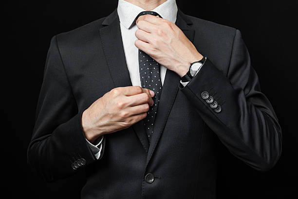 istock man in suit on a black background 482120760