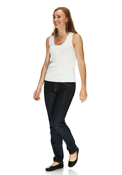 istock Happy young woman walking 482120873