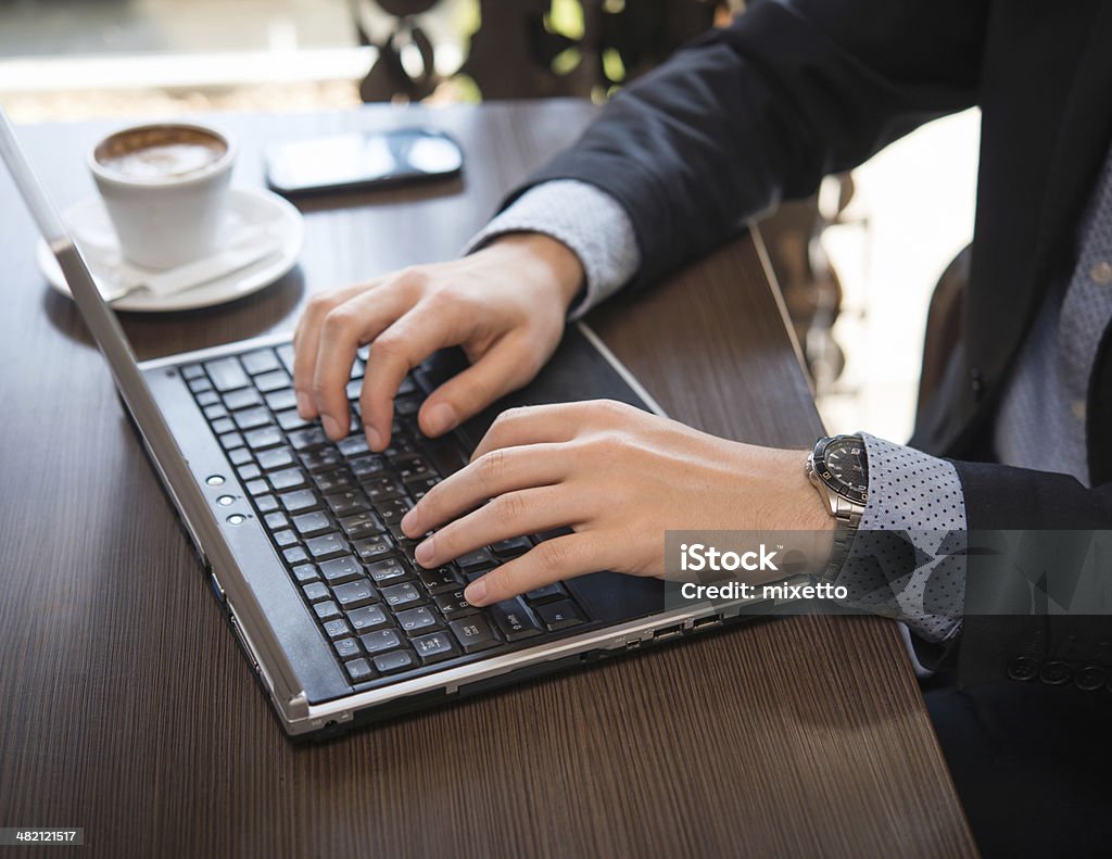 Typing on the laptop Adult Stock Photo
