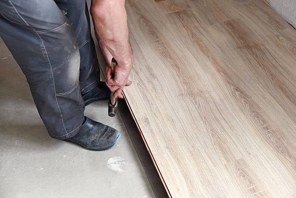 istock male carpenter puts the laminate 482131226