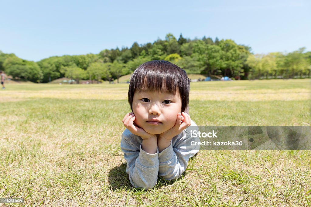 Children of Japan A little grumpy 3-year-old in the park Boys Stock Photo