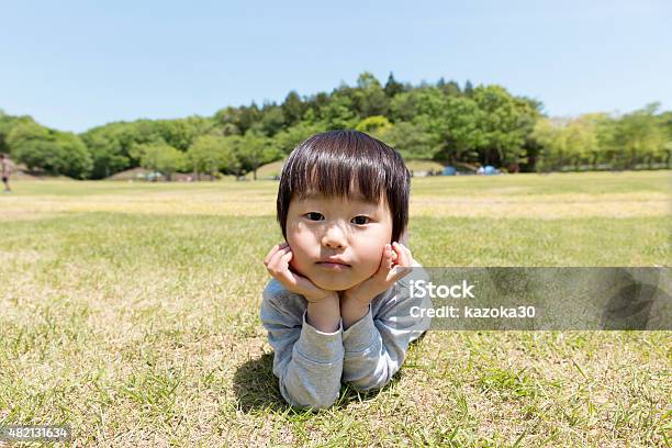 Children Of Japan Stock Photo - Download Image Now - Boys, Contemplation, Grass