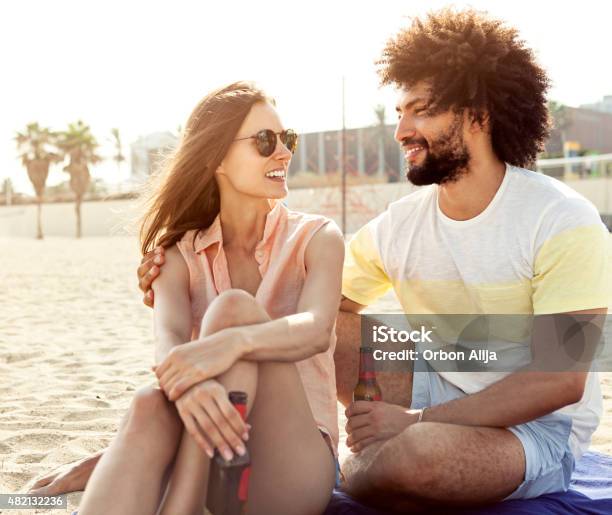 Young Couple On The Beach Stock Photo - Download Image Now - 20-29 Years, 2015, Adult