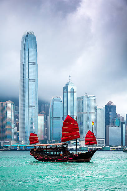 Traditional Chinese Junkboat Sailing Across Victoria Harbour, Hong Kong stock photo