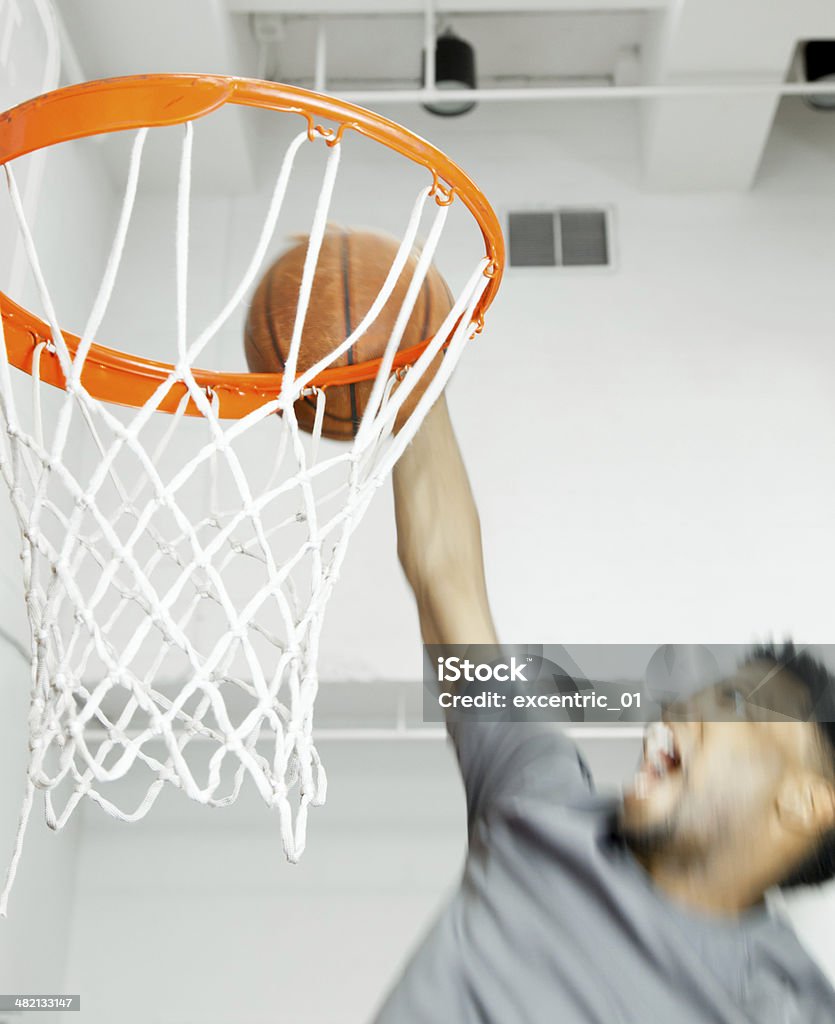 Afro-American 30 years old man playing basketball in a gymnasium Adult Stock Photo
