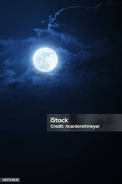 Dramatic Nighttime Clouds And Sky With Beautiful Full Blue Moon Stock Photo - Download Image Now