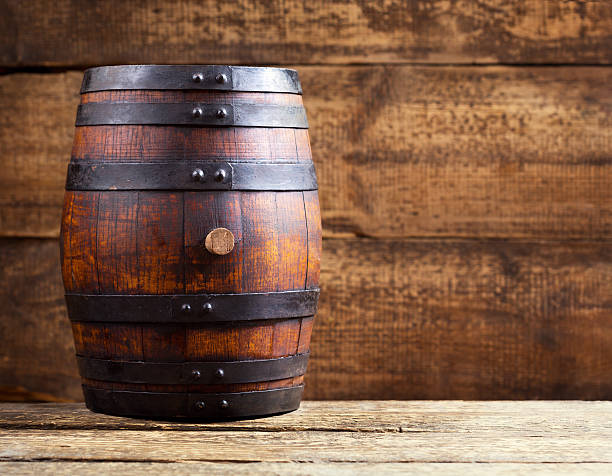 istock wooden barrel on rustic wooden background 482134400