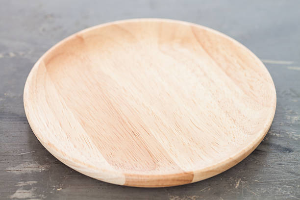 istock Wooden plate on gray background 482136812