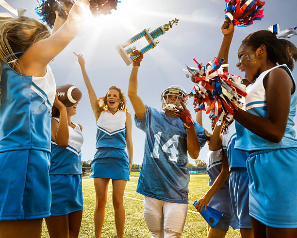 istock Football Cheerleaders & Player 482137271