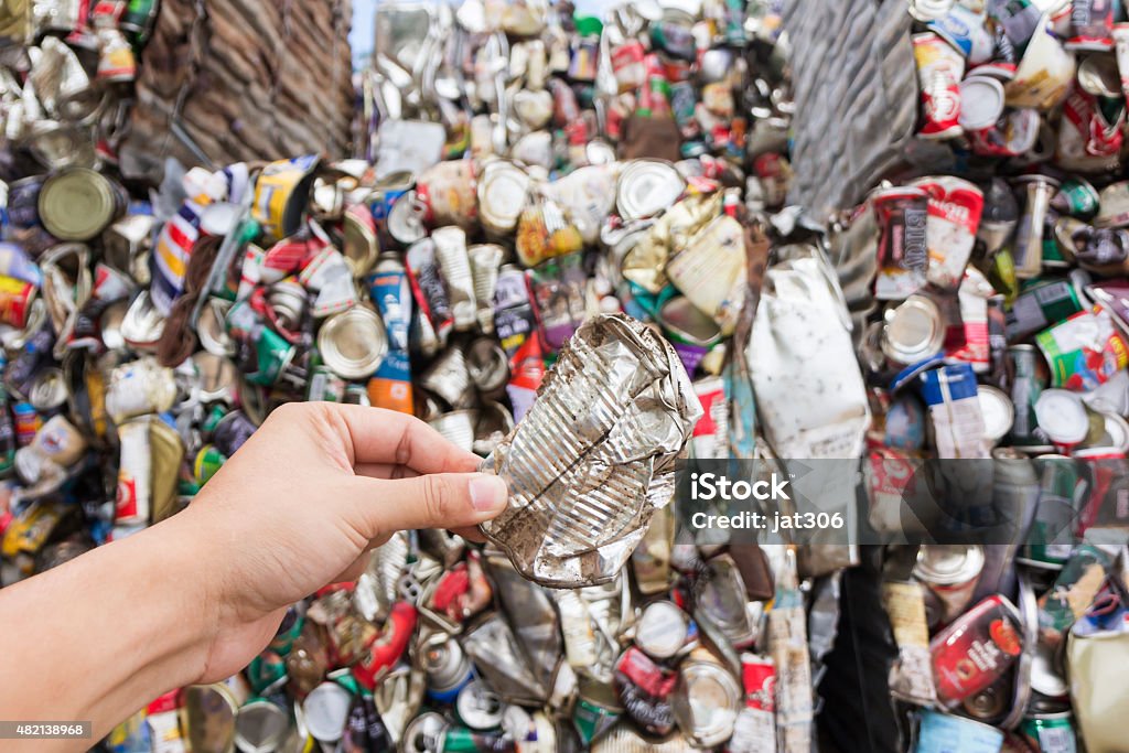 Hand holding aluminum can for recycle Can Stock Photo