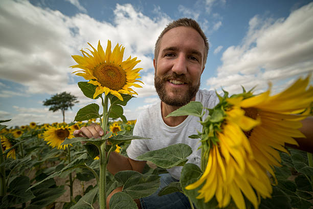 istock Man taking selfie in sunflower field 482139170