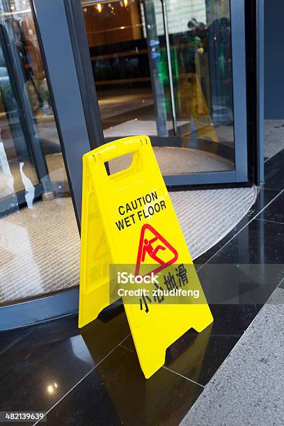 Sign Showing Warning Of Caution Wet Floor Stock Photo - Download Image Now - Care, Danger, Falling