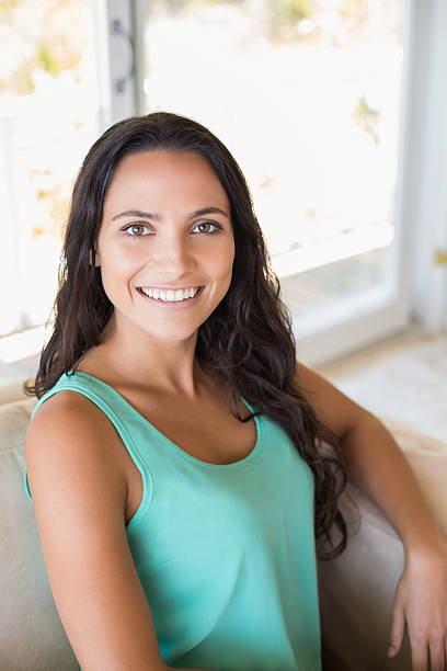 istock Pretty brunette sitting on the armchair 482140430